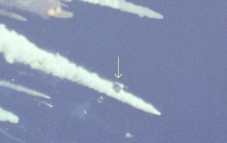 An detail of a photo following the explosion shows the intact crew cabin beginning its three-minute descent. Investigators believe that the crew survived the explosion, only to die when the crew cabin struck the ocean. (NASA)
